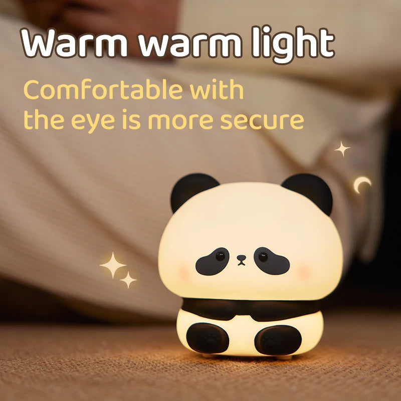 Veilleuse panda tactile à minuterie, sur une table de chevet